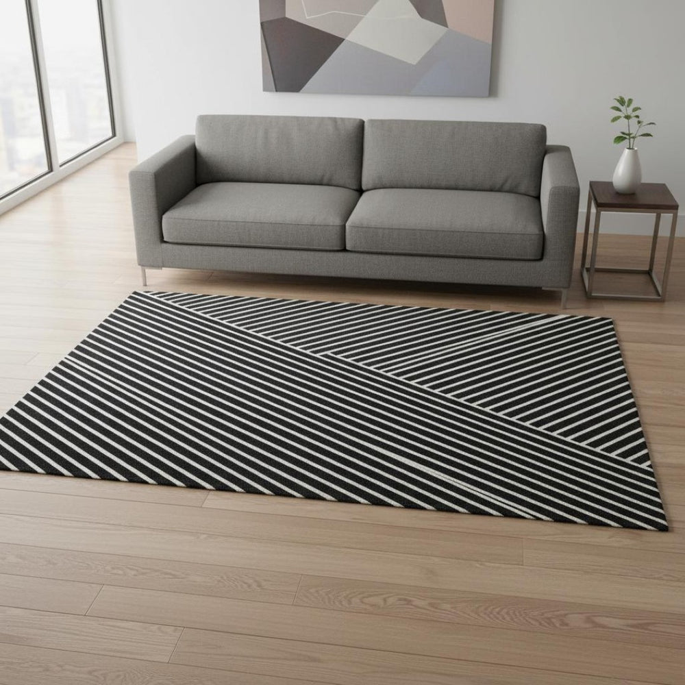 HomeRoots 5' X 8' Black And Ivory Geometric Area Rug - Washable, UV Protected, Stylish & Stain Resistant Design 674630