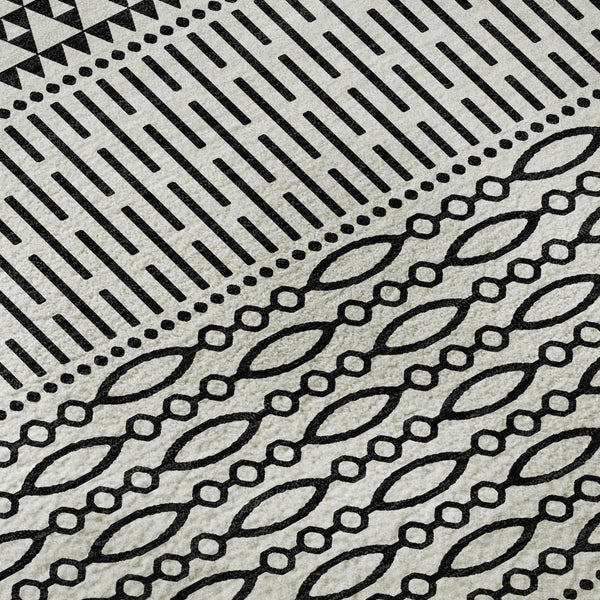 HomeRoots 8' White and Black Striped Washable Round Rug - Durable, UV-Protected, Easy-Care Design for Any Space 674823