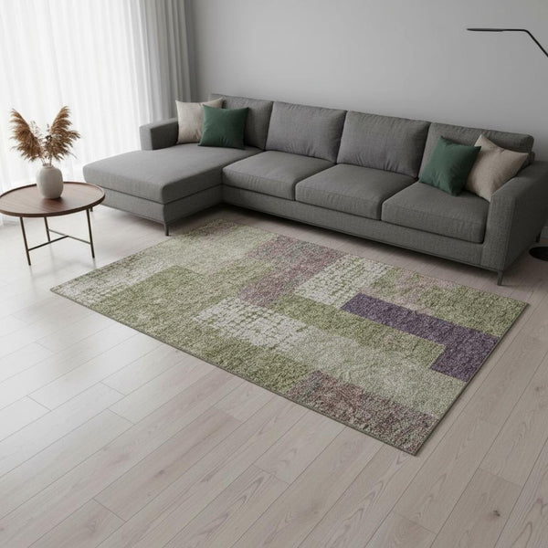 HomeRoots 9' X 12' Washable Geometric Area Rug in Green, Ivory & Purple with UV Protection for Modern Spaces 674945