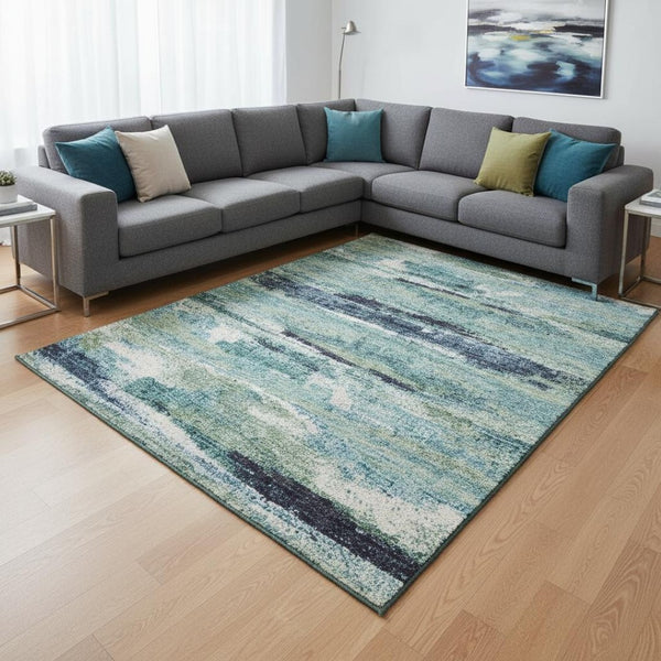HomeRoots 9' X 12' Contemporary Abstract Area Rug in Artichoke Green, Teal & Ivory - Durable, Washable & UV Protected 674981