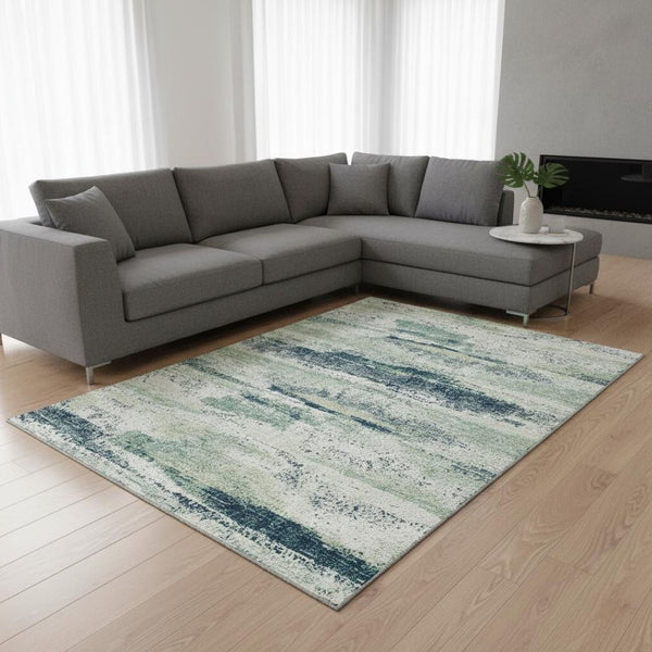 HomeRoots 10' Mint Green, Ivory, and Blue Abstract Area Rug - Washable, UV Protected, Stain Resistant, 10' x 14' 675030