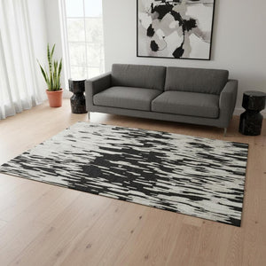 HomeRoots 5' X 8' Black And Ivory Abstract Area Rug - Stylish, Washable, UV Protected for Modern Homes & Pets 675134