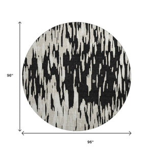 HomeRoots 8' Black And Ivory Abstract Round Rug - Washable, UV Protected, Durable & Family-Friendly Design! 675135