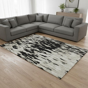 HomeRoots 10' X 14' Black And Ivory Abstract Area Rug - Stylish, Washable, UV-Protected for High-Traffic Areas 675138