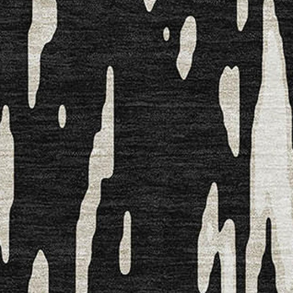 HomeRoots 10' X 14' Black And Ivory Abstract Area Rug - Stylish, Washable, UV-Protected for High-Traffic Areas 675138