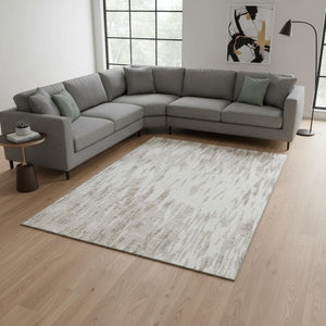 HomeRoots 9' X 12' Ivory and Beige Abstract Washable Area Rug with UV Protection for Kids and Pets' Safety 675173