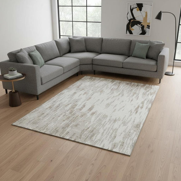 HomeRoots 9' X 12' Ivory and Beige Abstract Washable Area Rug with UV Protection for Kids and Pets' Safety 675173