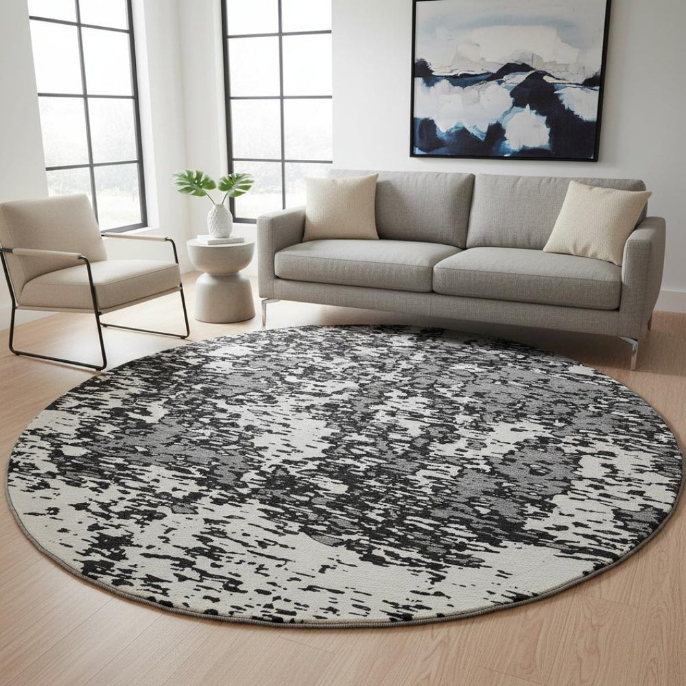HomeRoots 8' Black And Ivory Abstract Round Rug - Washable, UV Protected, Stain Resistant for Modern Homes 675207