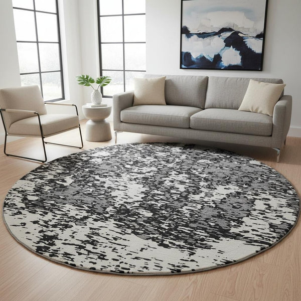HomeRoots 8' Black And Ivory Abstract Round Rug - Washable, UV Protected, Stain Resistant for Modern Homes 675207