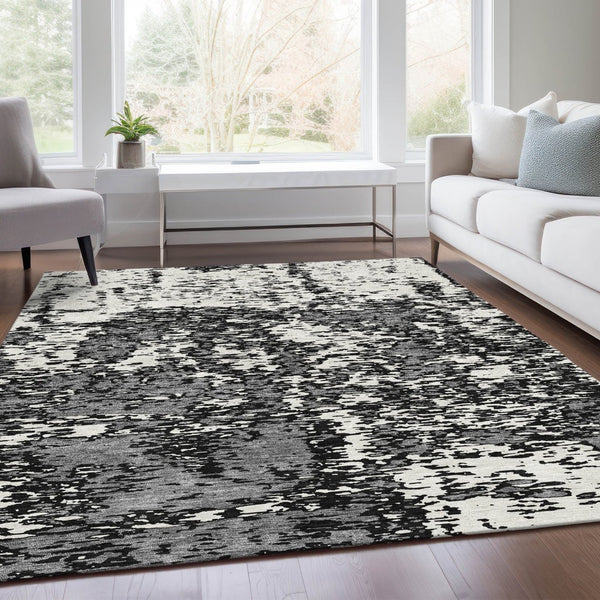 HomeRoots 8' X 10' Black And Ivory Abstract Washable Area Rug - Durable, Stylish, UV Protected for High-Traffic Homes 675208
