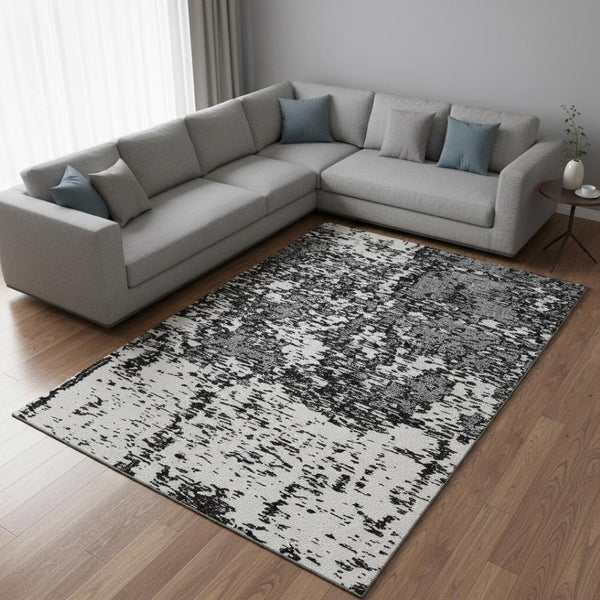 HomeRoots 9' X 12' Black and Ivory Abstract Washable Area Rug - Modern Design with UV Protection & Easy Care 675209