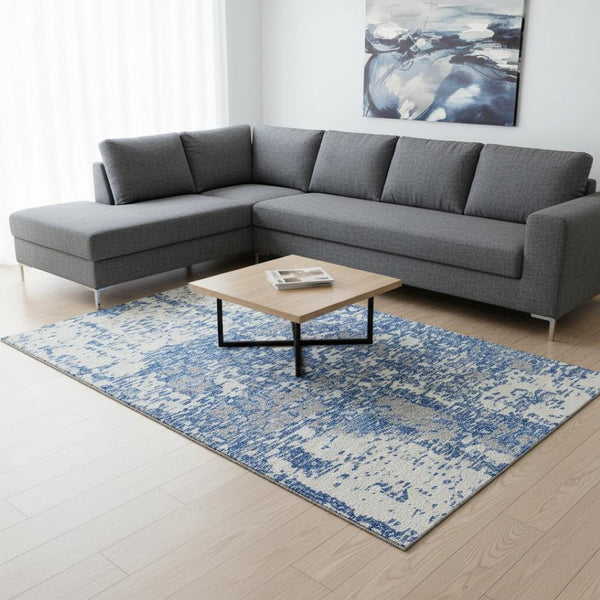 HomeRoots 9' X 12' Blue and Ivory Abstract Washable Area Rug - Durable, UV-Protected, Stylish for Any Room 675215