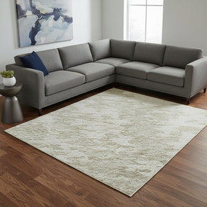 HomeRoots 9' X 12' Abstract Ivory and Beige Washable Area Rug with UV Protection for Stylish High-Traffic Spaces 675251