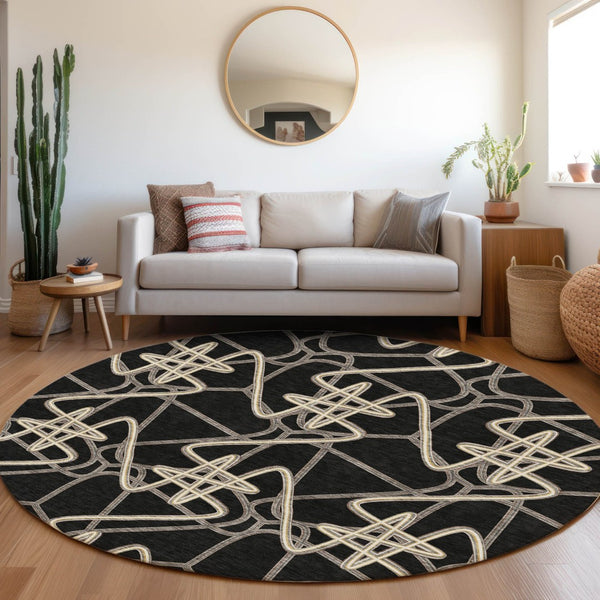 HomeRoots 8' Black and Ivory Geometric Round Rug – Stylish, Washable, UV-Protected for Modern Living Spaces 675285