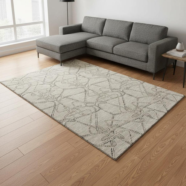 HomeRoots 9' X 12' Geometric Washable Area Rug in Beige, Ivory, and Gray - UV Protected, Kid-Friendly Style! 675323