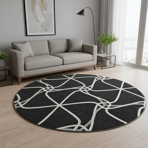 HomeRoots 8' Black And Ivory Geometric Round Rug - Washable, UV-Protected, Durable for Homes with Kids & Pets 675351