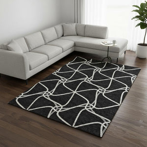 HomeRoots 8' X 10' Black and Ivory Geometric Area Rug - Stylish, Washable, UV Protected for Homes with Kids & Pets 675352