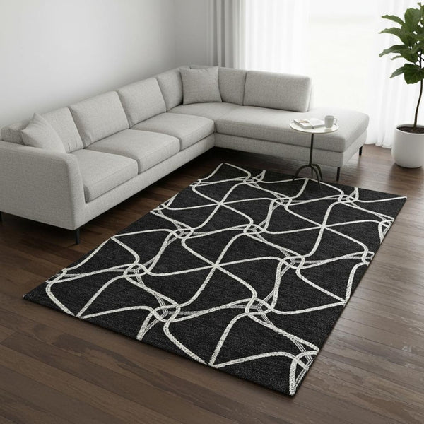 HomeRoots 8' X 10' Black and Ivory Geometric Area Rug - Stylish, Washable, UV Protected for Homes with Kids & Pets 675352