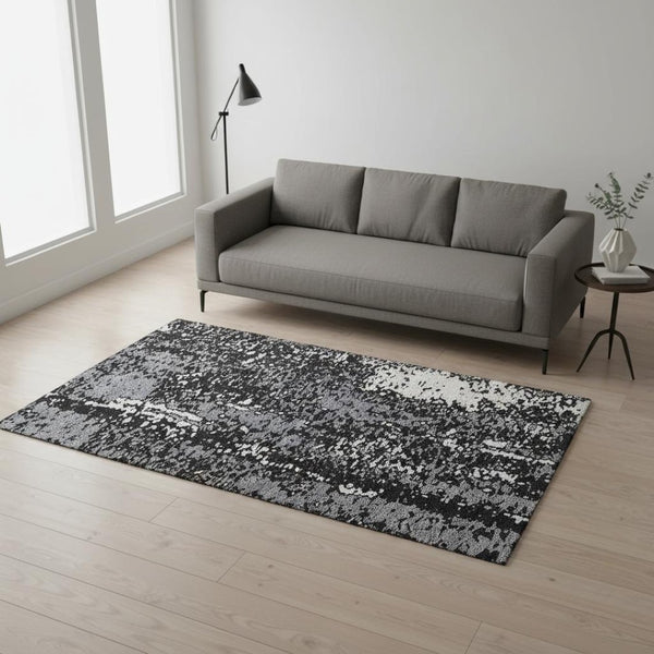 HomeRoots 5' X 8' Abstract Washable Area Rug in Black, Gray & Ivory - UV Protected, Durable & Stylish Design 675416