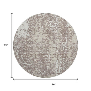 HomeRoots 8' Taupe and Ivory Abstract Round Rug - Washable, Stain-Resistant, UV Protected for Modern Spaces 675471