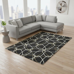 HomeRoots 9' X 12' Black Ivory and Gold Geometric Area Rug - Washable, UV-Protected, Perfect for Busy Homes! 675491