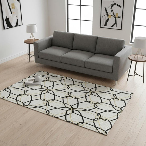 HomeRoots 5' X 8' Luxurious White, Black & Gold Geometric Washable Area Rug with UV Protection & Durability 675554