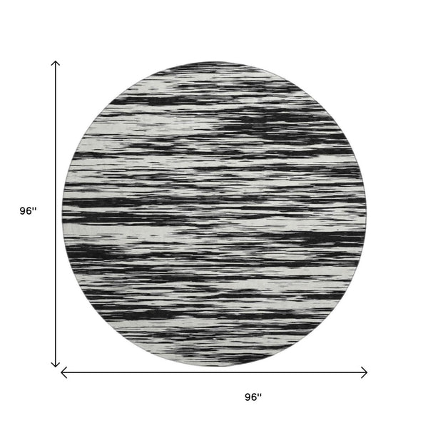 HomeRoots 8' Black and Ivory Striped Round Rug - Washable, UV Protected, Durable Design for Stylish Spaces 675567