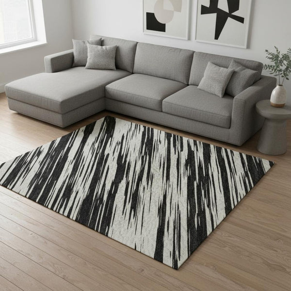 HomeRoots 9' X 12' Striped Black And Ivory Area Rug - Washable, UV Protected, Perfect For High-Traffic Spaces 675569
