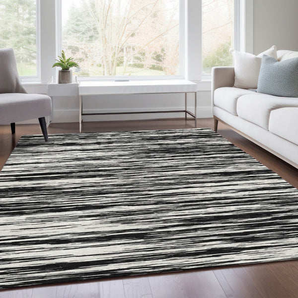 HomeRoots 9' X 12' Striped Black And Ivory Area Rug - Washable, UV Protected, Perfect For High-Traffic Spaces 675569