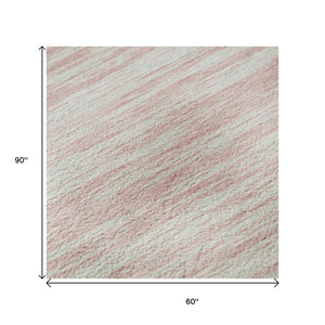 HomeRoots 5' X 8' Pink and Ivory Striped Washable Area Rug - Stylish, Durable, Stain-Resistant with UV Protection 675614