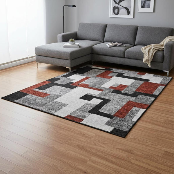 HomeRoots 9' X 12' Stylish Gray, Black & Red Geometric Washable Area Rug with UV Protection & Non-Slip Backing 675707
