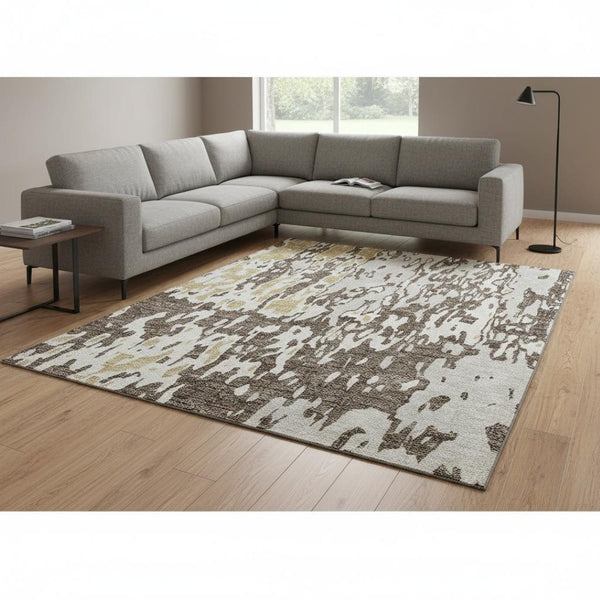 HomeRoots 9' X 12' Abstract Area Rug in Brown, Ivory & Gold - Washable, UV-Protected, Durable for High Traffic Homes 675833