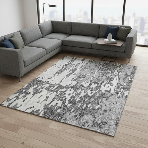 HomeRoots 9' X 12' Gray Ivory Silver Abstract Washable Area Rug with UV Protection for Modern Spaces 675845