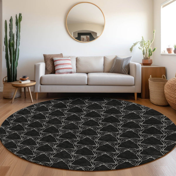 HomeRoots 8' Stylish Black and Ivory Geometric Round Rug – Washable, UV-Protected, Perfect for Busy Homes! 676041
