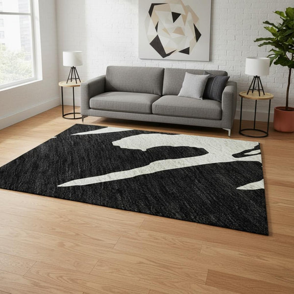 HomeRoots 5' X 8' Black And Ivory Abstract Area Rug - Washable, Stain Resistant, UV Protected for Versatile Spaces 676112