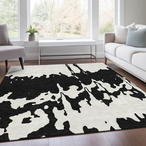 HomeRoots 5' X 8' Black And Ivory Abstract Area Rug - Washable, Stain Resistant, UV Protected for Versatile Spaces 676112