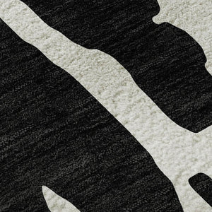 HomeRoots 5' X 8' Black And Ivory Abstract Area Rug - Washable, Stain Resistant, UV Protected for Versatile Spaces 676112