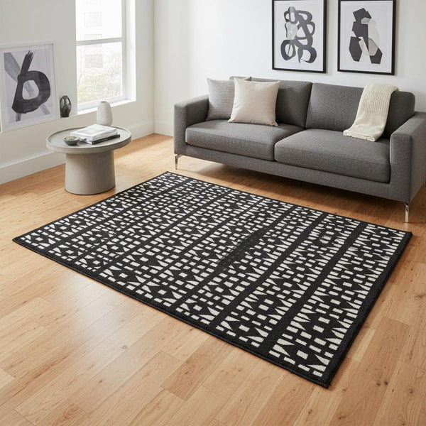 HomeRoots 5' X 8' Black And Ivory Geometric Area Rug - Stylish, Washable, UV Protected for Busy Homes 676250