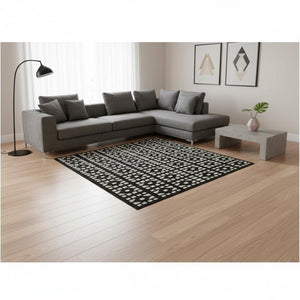 HomeRoots 8' X 10' Black & Ivory Geometric Washable Area Rug with UV Protection for Modern Living Spaces 676252