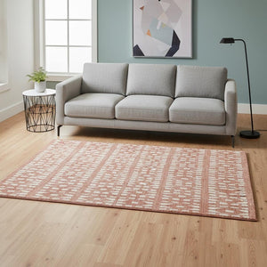 HomeRoots 5' X 8' Salmon & Ivory Geometric Area Rug - Washable, UV Protected, Ideal for Homes with Kids & Pets 676292