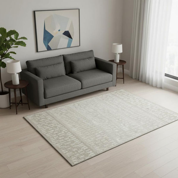 HomeRoots 5' X 8' Ivory And Beige Geometric Area Rug – Washable, UV Protected, Stain Resistant for High Traffic Areas 676346