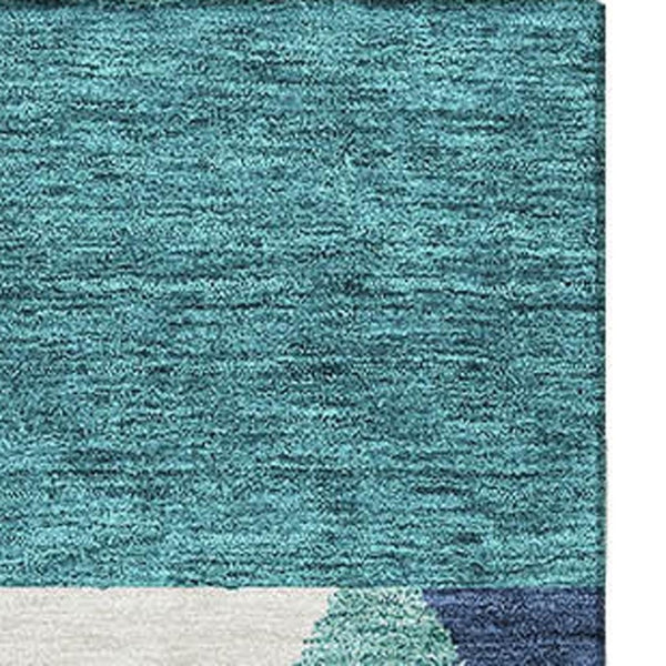 HomeRoots 8' X 10' Southwestern Area Rug in Teal, Navy Blue & Ivory - Durable, Washable & UV-Protected Design 676444