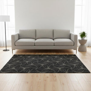 HomeRoots 5' X 8' Black And Ivory Geometric Area Rug – Washable, UV Protected, Ideal for Modern Homes & Families 676550