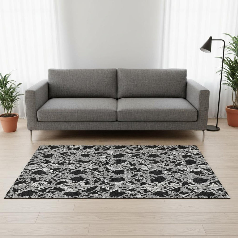 HomeRoots 5' X 8' Abstract Washable Area Rug in Black, Gray & Ivory - UV Protected, Modern Design for High-Traffic Spaces 676616