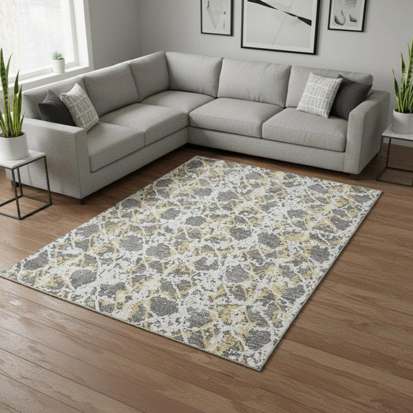 HomeRoots 9' X 12' Modern Abstract Area Rug - Gray, Gold, Ivory, Washable, Stain-Resistant & UV Protected 676649