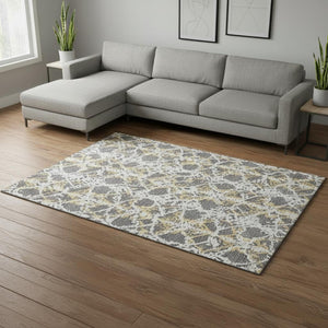 HomeRoots 10' X 14' Gray Gold and Ivory Abstract Area Rug - Washable, UV Protected, Perfect for Modern Homes! 676650