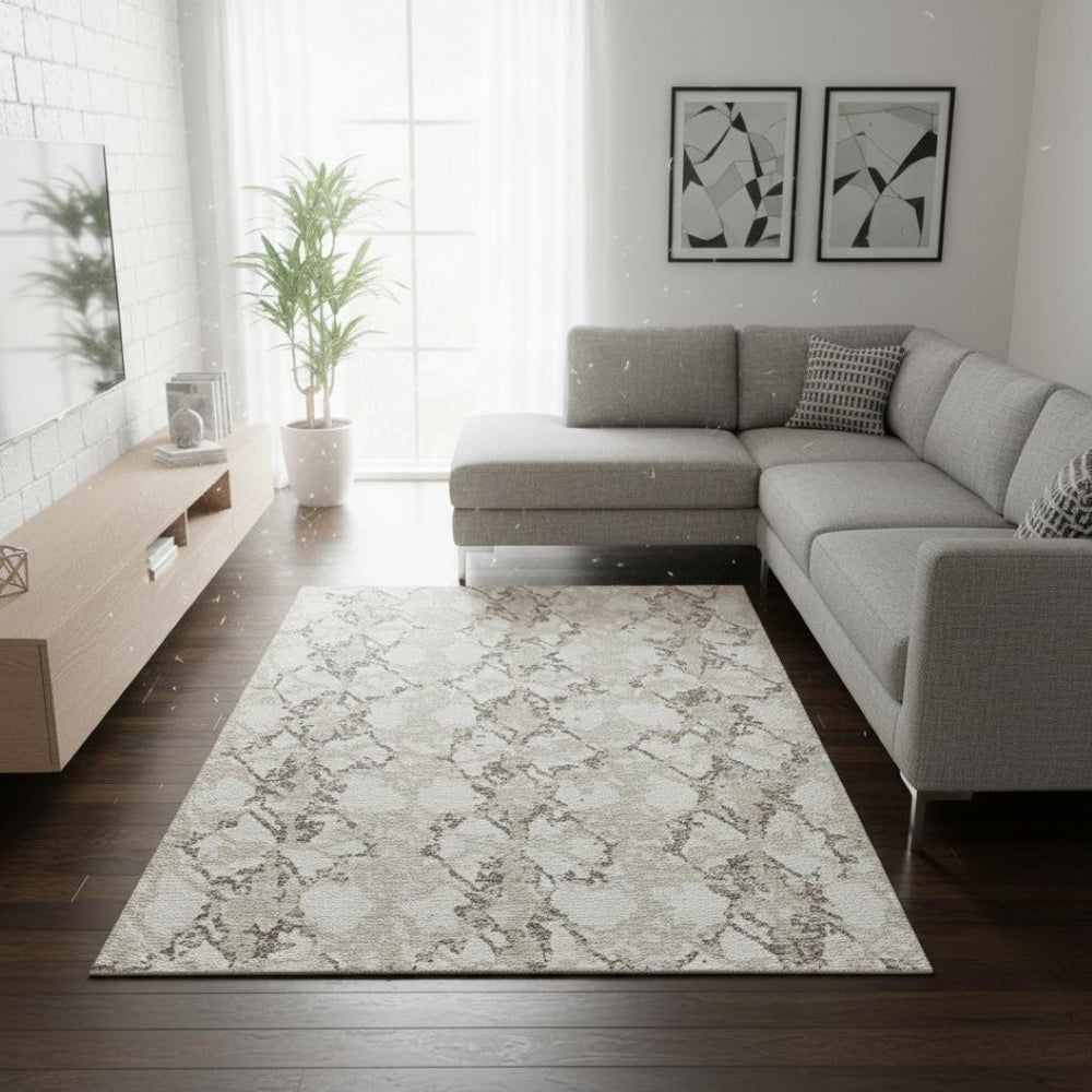 HomeRoots 9' X 12' Abstract Washable Area Rug in Ivory Taupe & Beige - Durable, UV-Protected, Easy-Care Design 676661
