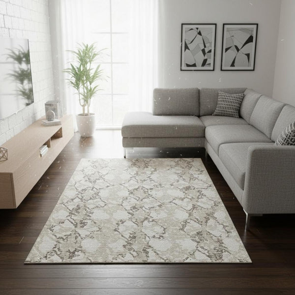 HomeRoots 9' X 12' Abstract Washable Area Rug in Ivory Taupe & Beige - Durable, UV-Protected, Easy-Care Design 676661