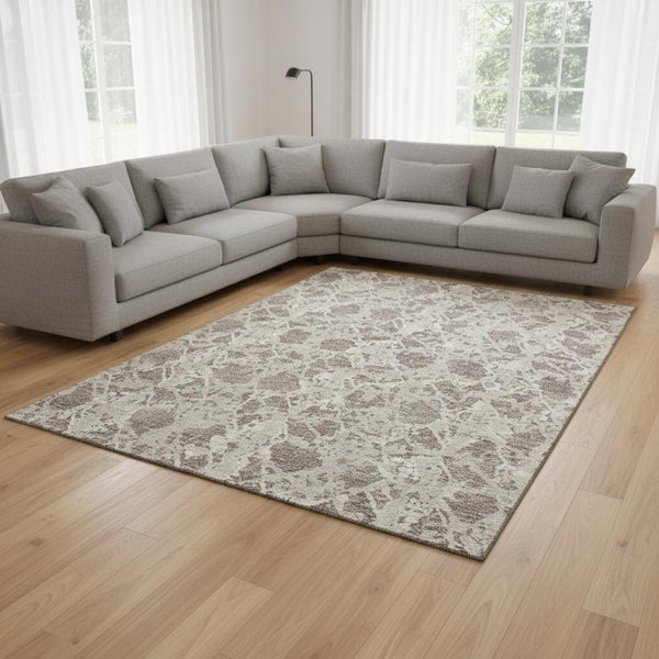 HomeRoots 10' X 14' Washable Taupe Beige Ivory Abstract Area Rug with UV Protection for Modern Living Spaces 676686