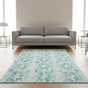 HomeRoots 5' X 8' Teal And Ivory Abstract Area Rug - Washable, UV Protected, Durable for High-Traffic Spaces 676688